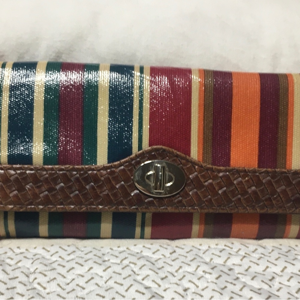 Womens striped faux leather bi-fold wallet.